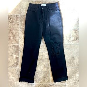 Velvet black jeans, slightly distressed.